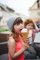 two cute hipsters eating icecream