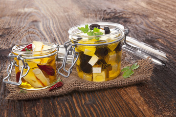 Camembert cheeses in oil.