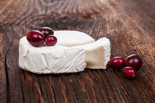 Camembert cheese with red berries