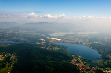 Alps, lakes, fields and towns neal Malpensa Airport (Milan, Italy) seen from an airplane