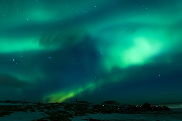 Fototapeta na wymiar Picturesque Unique Northern Lights Aurora Borealis Over Lofoten Islands in Nothern Part of Norway.