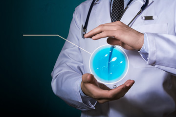 The doctor holds a semen icon in his hands. Protection of the reproductive system of men. Reproductive Wellness. HUD for notes.