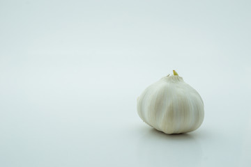 A bulb of garlic over white background