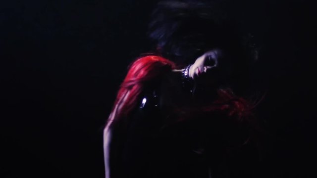 Beautiful Woman dancing on stage with flares and lights, Young Pretty Female dancing.