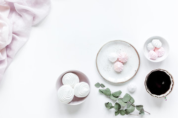 woman lunch with marsh-mallow, coffee and flowers soft light on white table background flat lay mockup