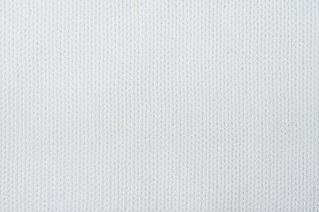 Sweater or scarf fabric texture large knitting. Knitted jersey background with a relief pattern. Wool hand- machine, handmade.