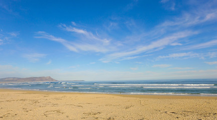 Blue Sky and Clouds over the Beach and Ocean