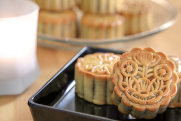 Moon cakes on wooden table.