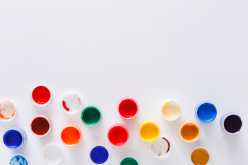 Artist workplace, set of color paints on white