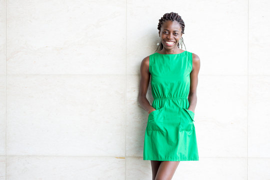 Happy Young African American Woman In Green Dress