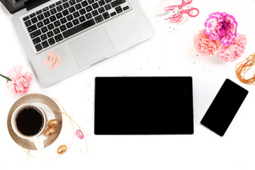 White, gold and pink womens office desk table with a lot of things on it. Top view with copy space.