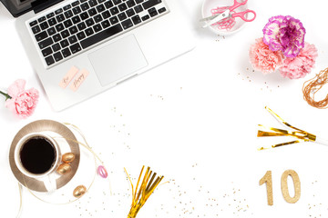 White, gold and pink womens office desk table with a lot of things on it. Top view with copy space.