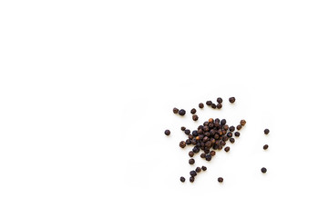 Dried whole seed of black pepper isolated on a white background seen from above