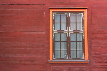 Old time window in old wooden house.