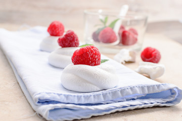 Pavlova - mini meringue cake with raspberries , copy space, close up, selective focus.