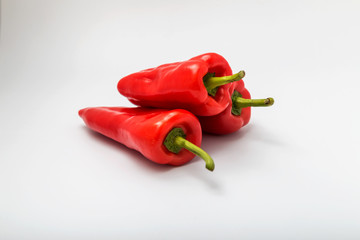 Red Chilli Peppers On White Background
