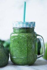 Green vegetables smoothies prepared with cauliflower on a white background