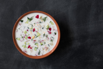 Okroshka. Traditional russian Summer yoghurt cold soup with vegetables