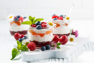 sweet dessert with jam, cream and fresh fruit