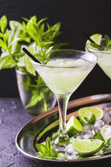 Classic daiquiri cocktail with lime, ice and mint