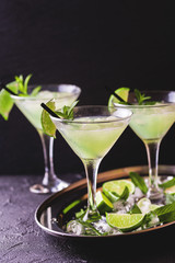 Classic daiquiri cocktail with lime, ice and mint