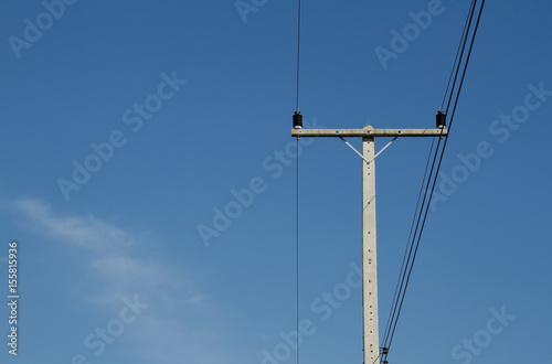 An Old Telephone Electricity Pole For Energy With Power Lines Over A Clear Blue Sky Wall Mural Changphoto