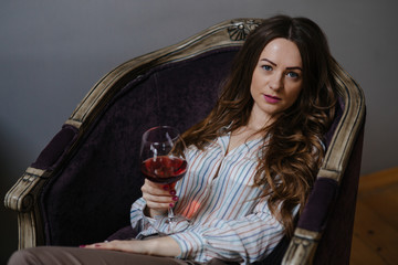 Attractive brunette holding a glass of wine