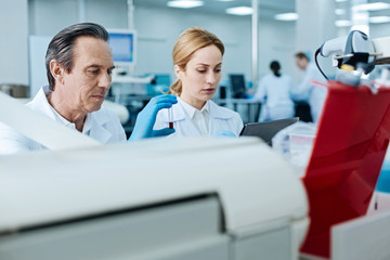 Two practitioners working together in the lab