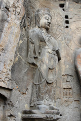 Fototapeta na wymiar Budha's rock statue at Longmen Grottoes, Luoyang, Henan, China