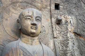 Monk rock statue at Longmen Grottoes, Luoyang, Henan, China