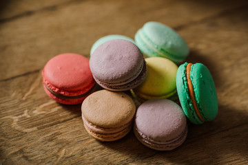 vivid color macaroons on wooden table
