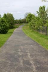 Fototapeta na wymiar The winding walkway in the park.