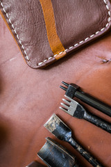 DIY leather bifold wallet with crafts tool object