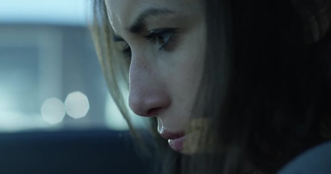 angry woman on smart phone - extreme close up