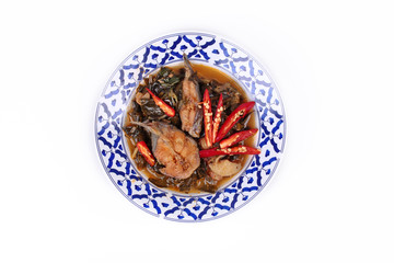 Spicy sliced catfish curry in coconut milk with Morinda citrifolia leaf .