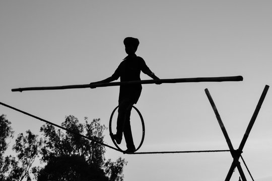 Young Boy Tightrope walking, Slacklining, Funambulism, Rope Balancing