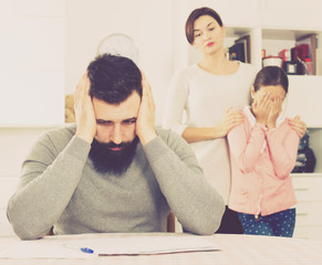 Young family struggling to pay utility bills and rent for their apartment