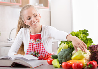 Woman reading recipe book