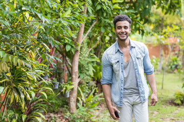 Fototapeta premium Young Hispanic Man Tropical Forest Holiday Guy Happy Smiling Summer Vacation Travel
