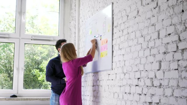 Two web designers prototyping website layout
