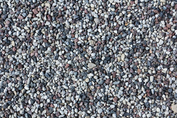 Small gray stones on a ground.