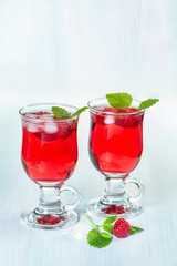 Fototapeta na wymiar Alcohol cocktail with raspberries and mint
