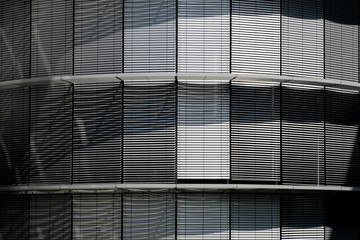 Closed blinds, metallic shutters on modern building