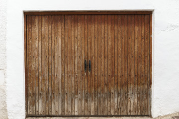 Old brown garage door of a mediterranean house,Altea, Alicante, Spain