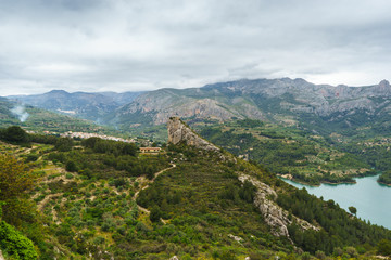 Fototapeta na wymiar Landscape from the balcony of Guadalest in a cloudy day, Spain