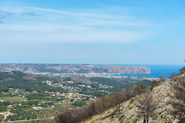 Landscape of the coast of Xavea, Alicante, Spain with a burn area of forrest