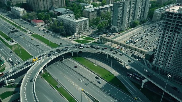 Traffic jam on city road junction in Moscow, Russia. 4K aerial video