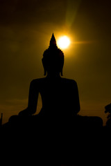 silhouette Big Buddha on sunset background in Phichit, Thailand