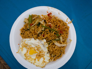 Stir fried noodle with eggs and vegetable, cambodia food.