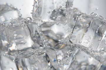 Closeup soda bubbles and ice.